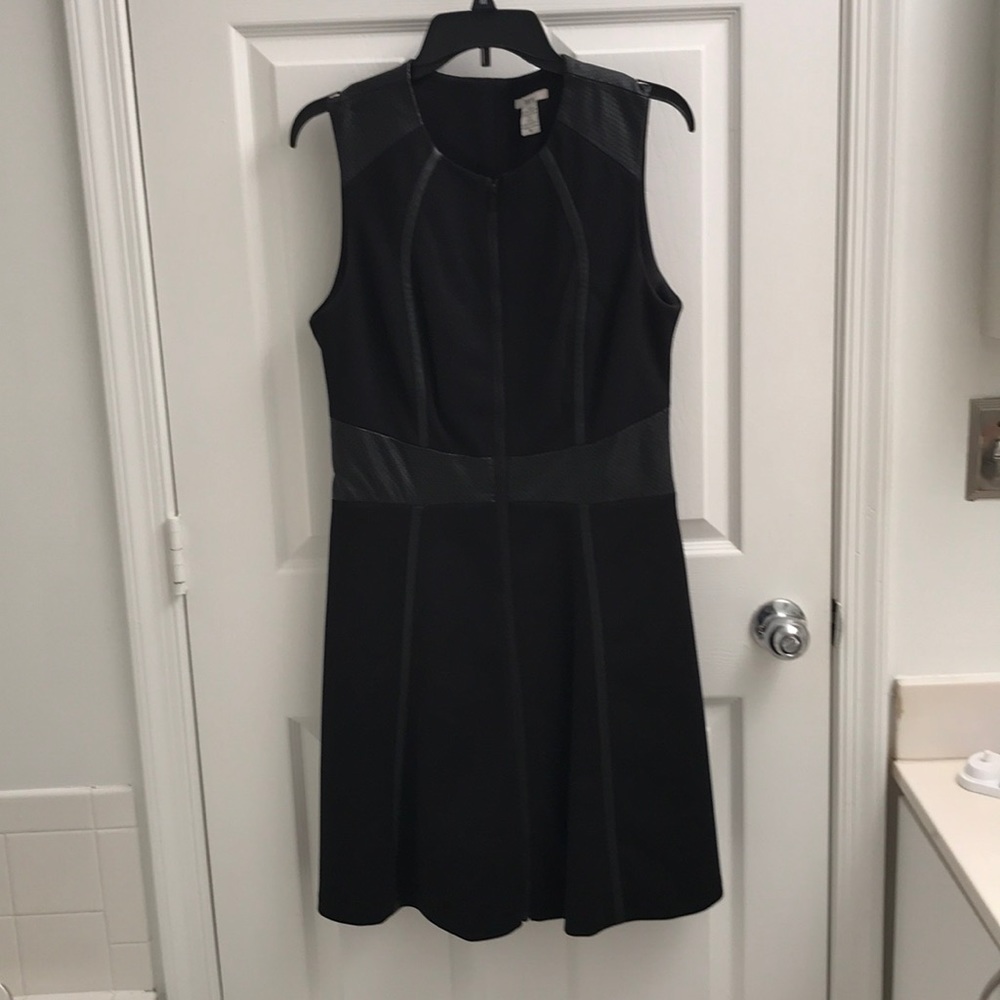 Unique dress with leather-like appliqués
